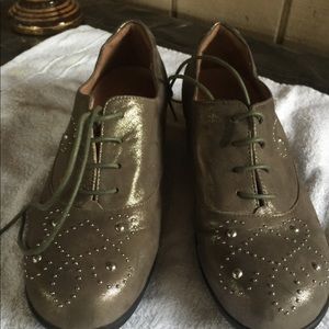 Brand new walking shoe in a golden copper color.